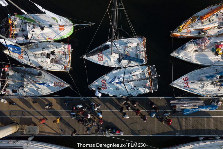 Voiliers Mini 6.50 vus de haut avant la course Plastimo Lorient Mini, à Lorient La Base (Morbihan)